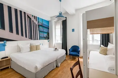 Un ou plusieurs lits dans un hébergement de l'établissement Hôtel du Simplon