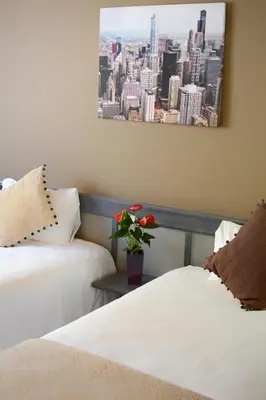 Un ou plusieurs lits dans un hébergement de l'établissement Hotel Gratte-Ciel Ariana
