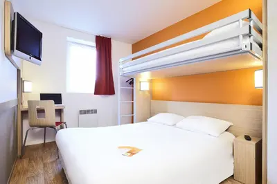 Un ou plusieurs lits dans un hébergement de l'établissement Première Classe Lyon Sud - A7