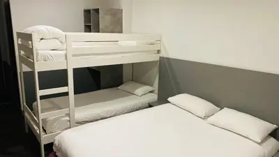 Un ou plusieurs lits dans un hébergement de l'établissement Hotel Martinez Grenay