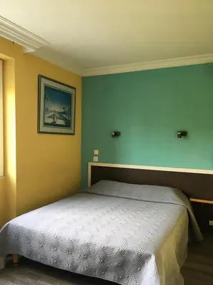 Un ou plusieurs lits dans un hébergement de l'établissement Hôtel Au Val De Saône Free Parking