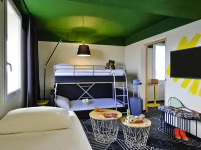 Un ou plusieurs lits dans un hébergement de l'établissement ibis Styles Lyon Meyzieu Arena Stadium
