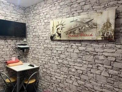 Télévision ou salle de divertissement dans l'établissement Au Coeur De Lyon