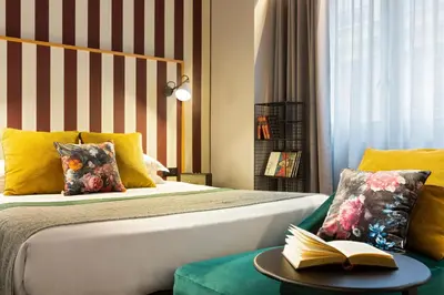Un ou plusieurs lits dans un hébergement de l'établissement Hôtel Edmond W Lyon Part-Dieu