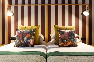 Un ou plusieurs lits dans un hébergement de l'établissement Hôtel Edmond W Lyon Part-Dieu