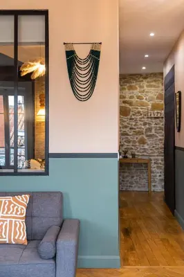 Coin salon dans l'établissement Host Inn Natty Sūite