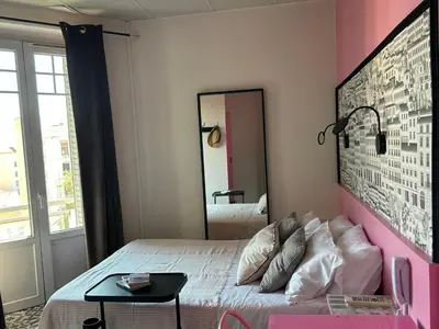 Un ou plusieurs lits dans un hébergement de l'établissement Hôtel de la Croix-Rousse