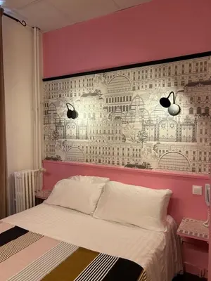 Un ou plusieurs lits dans un hébergement de l'établissement Hôtel de la Croix-Rousse
