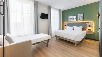 Un ou plusieurs lits dans un hébergement de l'établissement Campanile PRIME - Lyon Centre - Gare Perrache