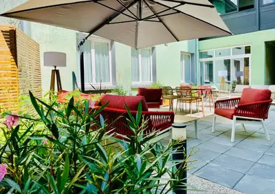 Coin salon dans l'établissement Hôtel Villa Berlioz
