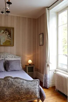 Un ou plusieurs lits dans un hébergement de l'établissement Chateau de Breuil en Beaujolais