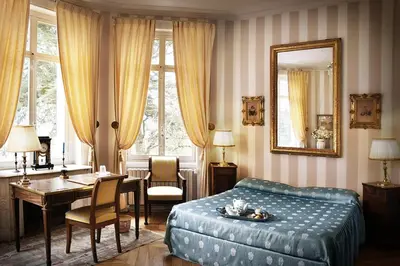 Un ou plusieurs lits dans un hébergement de l'établissement Château de Varambon - chambres d'hôtes et séminaires d'entreprise