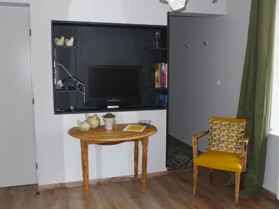 Télévision ou salle de divertissement dans l'établissement Le Moulin de Saint-Julien