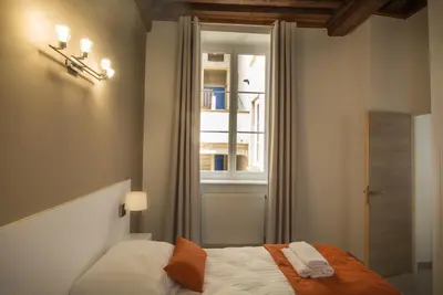 Un ou plusieurs lits dans un hébergement de l'établissement Lyon Cosy Stay