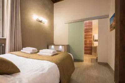Un ou plusieurs lits dans un hébergement de l'établissement Lyon Cosy Stay