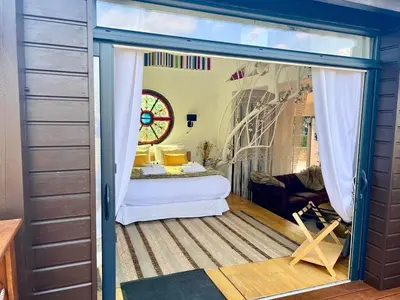 Un ou plusieurs lits dans un hébergement de l'établissement Cabane Spa Sauna