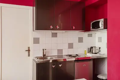 Cuisine ou kitchenette dans l'établissement Residence Avy Baudelaire - Lyon Bellecour