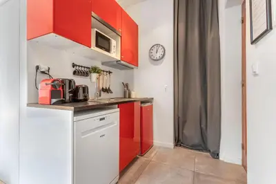 Cuisine ou kitchenette dans l'établissement Le Cocon Lumière