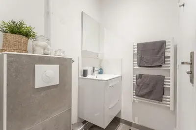 Salle de bains dans l'établissement Le Cocon Lumière