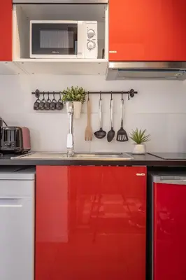 Cuisine ou kitchenette dans l'établissement Le Cocon Lumière