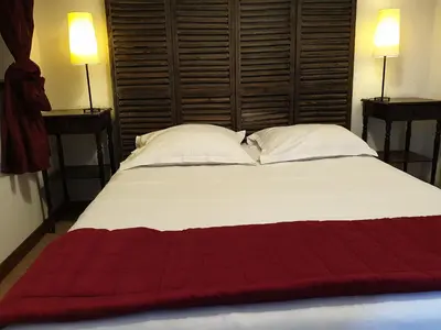 Un ou plusieurs lits dans un hébergement de l'établissement Le Relais Des Dix Crus - Logis Hôtel