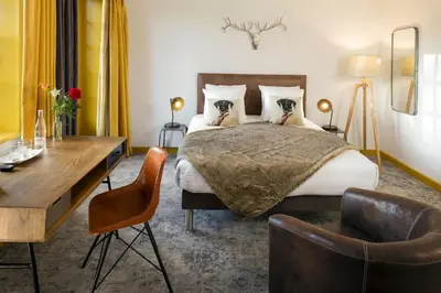 Un ou plusieurs lits dans un hébergement de l'établissement Contact Hôtels Le Savigny & Spa