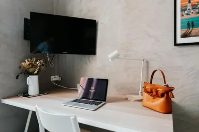 Télévision ou salle de divertissement dans l'établissement Hôtel Taggât