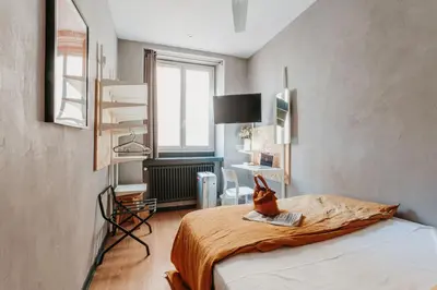 Un ou plusieurs lits dans un hébergement de l'établissement Hôtel Taggât