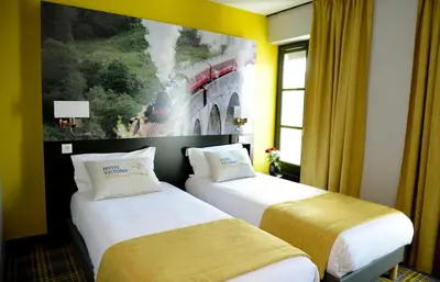 Un ou plusieurs lits dans un hébergement de l'établissement Hotel Victoria Lyon Perrache Confluence