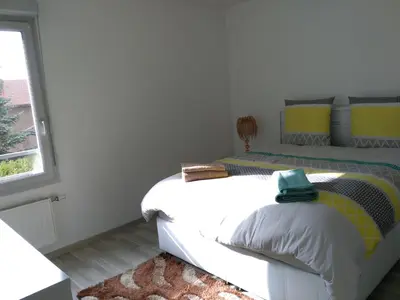 Un ou plusieurs lits dans un hébergement de l'établissement Appartement F3 avec Parking privée