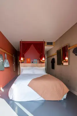 Un ou plusieurs lits dans un hébergement de l'établissement MOB HOTEL Lyon Confluence