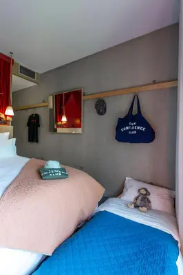 Un ou plusieurs lits dans un hébergement de l'établissement MOB HOTEL Lyon Confluence