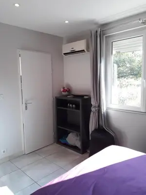 Un ou plusieurs lits dans un hébergement de l'établissement Guest House Domaine des Grouilleres