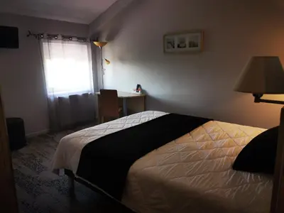 Un ou plusieurs lits dans un hébergement de l'établissement Château Blanchard