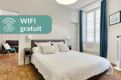 Un ou plusieurs lits dans un hébergement de l'établissement Appartement Saint Jean