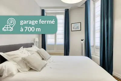 Un ou plusieurs lits dans un hébergement de l'établissement Appartement Saint Jean