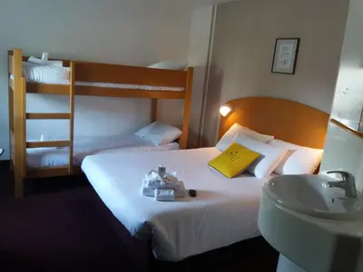 Un ou plusieurs lits dans un hébergement de l'établissement Quick Palace Lyon Saint-Priest