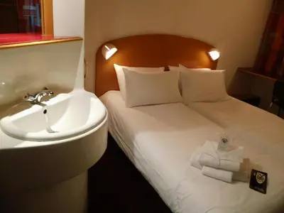 Un ou plusieurs lits dans un hébergement de l'établissement Quick Palace Lyon Saint-Priest