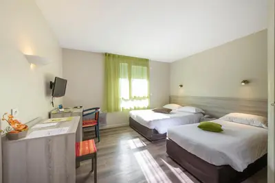 Un ou plusieurs lits dans un hébergement de l'établissement Hotel Le Chatard