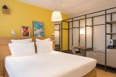 Un ou plusieurs lits dans un hébergement de l'établissement Maison Nô - Hôtel et Rooftop