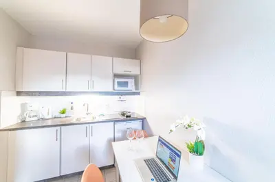 Cuisine ou kitchenette dans l'établissement Résidence Montempô Appart'Hôtel Lyon Part Dieu