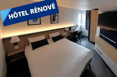 Télévision ou salle de divertissement dans l'établissement Kyriad Villefranche Sur Saone Porte du Beaujolais -Rénové-