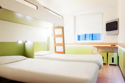 Un ou plusieurs lits dans un hébergement de l'établissement ibis budget Lyon Est Chaponnay