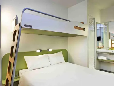 Un ou plusieurs lits dans un hébergement de l'établissement ibis budget Lyon Est Chaponnay