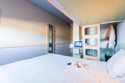 Un ou plusieurs lits dans un hébergement de l'établissement ibis budget Amberieu en Bugey/Chateau Gaillard A42