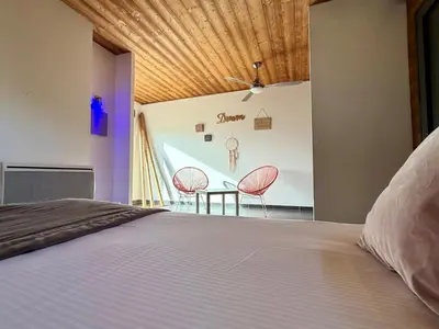 Un ou plusieurs lits dans un hébergement de l'établissement Bio-Motel
