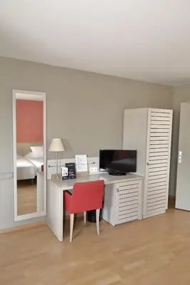Télévision ou salle de divertissement dans l'établissement Hôtel Newport