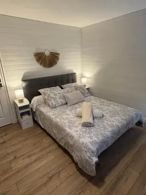 Un ou plusieurs lits dans un hébergement de l'établissement Chambre d'Hôtes du Vieux Collonges