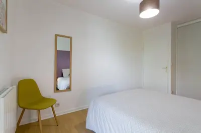 Un ou plusieurs lits dans un hébergement de l'établissement Appartement Lyon Centre Confluence 100 m2 Parking Terrasses