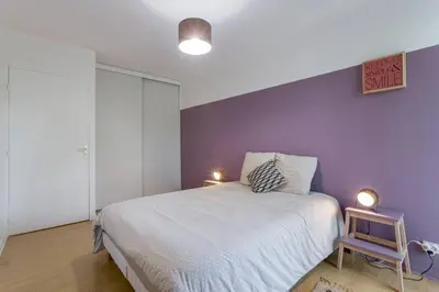 Un ou plusieurs lits dans un hébergement de l'établissement Appartement Lyon Centre Confluence 100 m2 Parking Terrasses